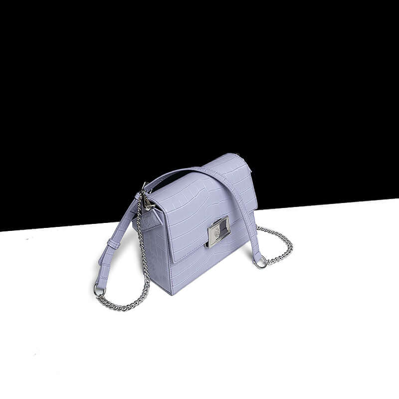 Crocodile-Pattern Leather Handbag – Versatile Carry in light purple with a chain strap on a black and white background.