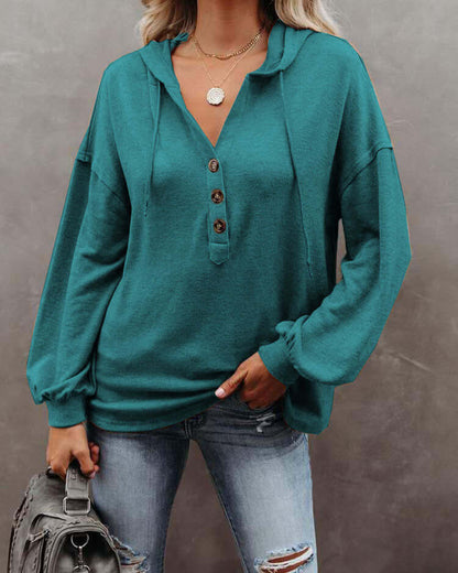 Autumn and Winter Solid Color Loose Hooded Woman in teal with button details and relaxed fit.