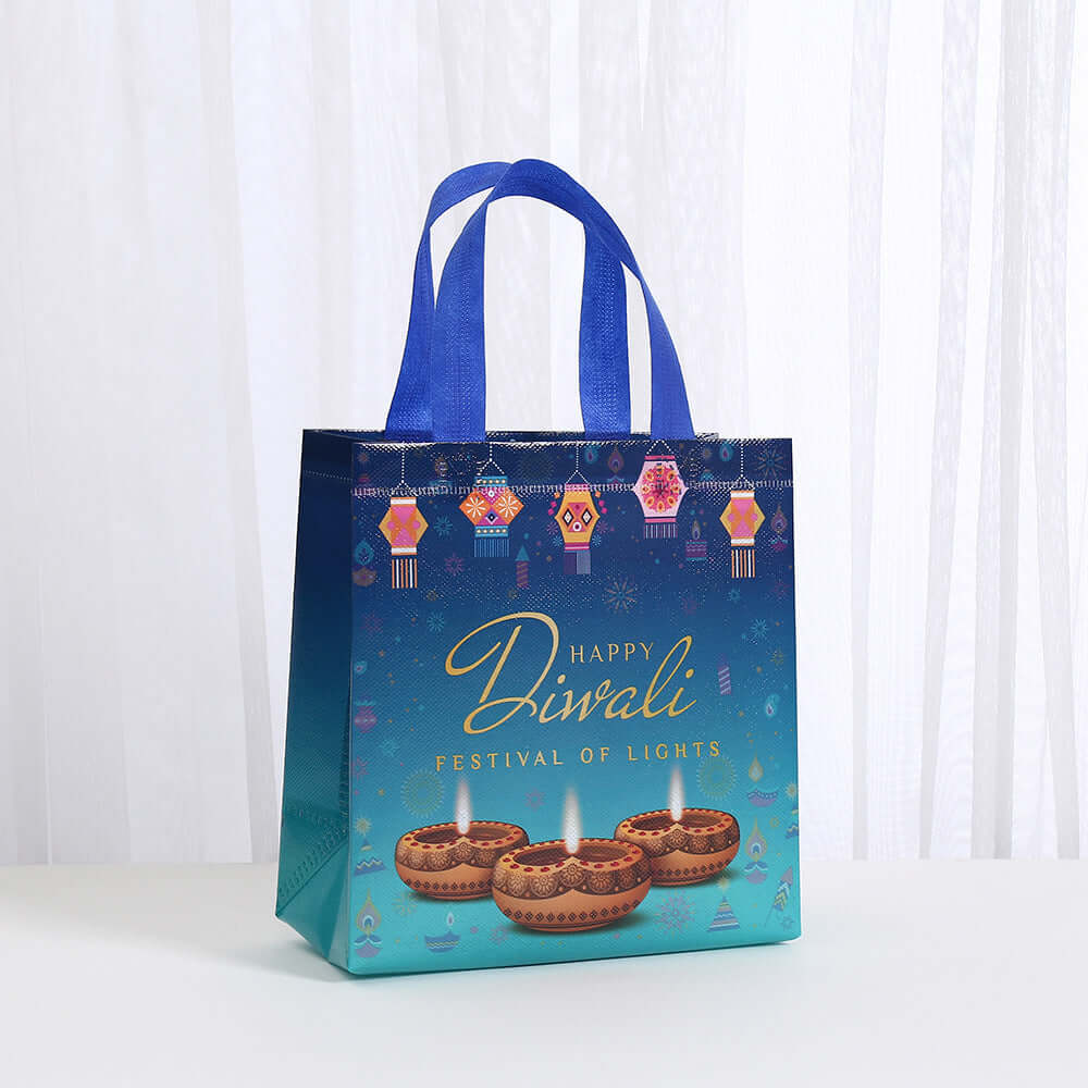 Waterproof Takeaway Shopping Bags Indian Festival Hand with colorful Diwali design and sturdy blue handles.
