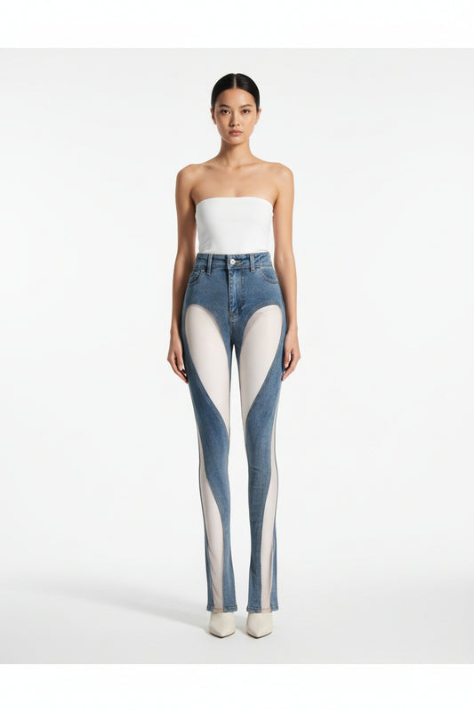 Hollow Irregular Patchwork Jeans Woman worn by model, showcasing unique hollow design and high waist.