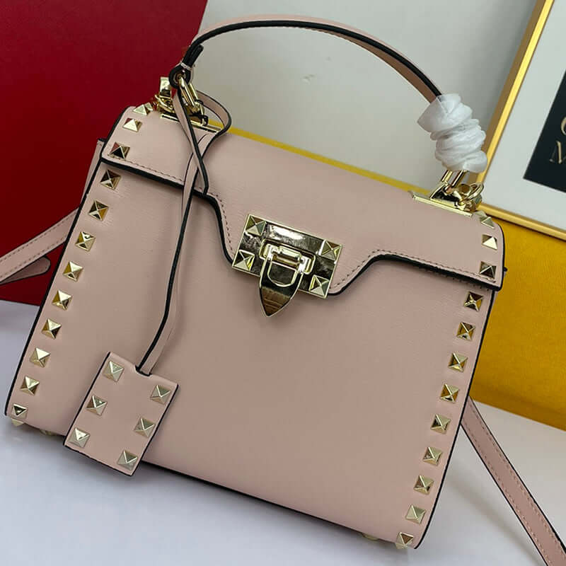 Cowhide Rivet-bound Women's Bag With Single-shoulder Messenger Pattern featuring stylish rivets and gold lock.