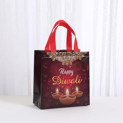 Waterproof Takeaway Shopping Bags Indian Festival Hand with festive Happy Diwali design and red handles.