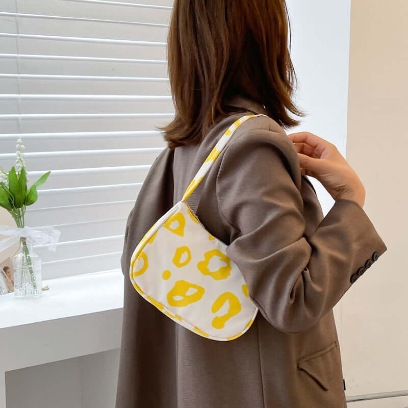 Korean Street Trend Hand-carried Women's Bags in yellow and white pattern, suitable for daily use and stylish street fashion.