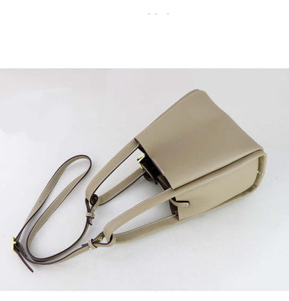 Make Your Own Leather Bags Hand Sewing Handmade Leather Goods in beige color with a stylish design and adjustable straps.