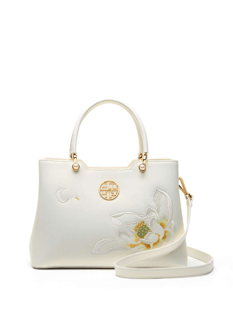 Cowhide Floral Crossbody Shoulder Bag for Cheongsam in white color with flower embroidery and gold accents.