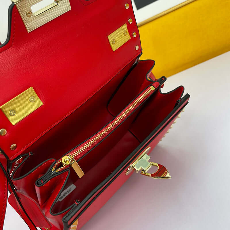 Interior view of Cowhide Rivet-bound Women's Bag With Single-shoulder Messenger Pattern showcasing red leather and gold accents.