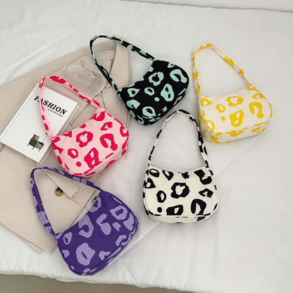 Korean Street Trend Hand-carried Women's Bags in vibrant colors featuring stylish patterns on nylon material.