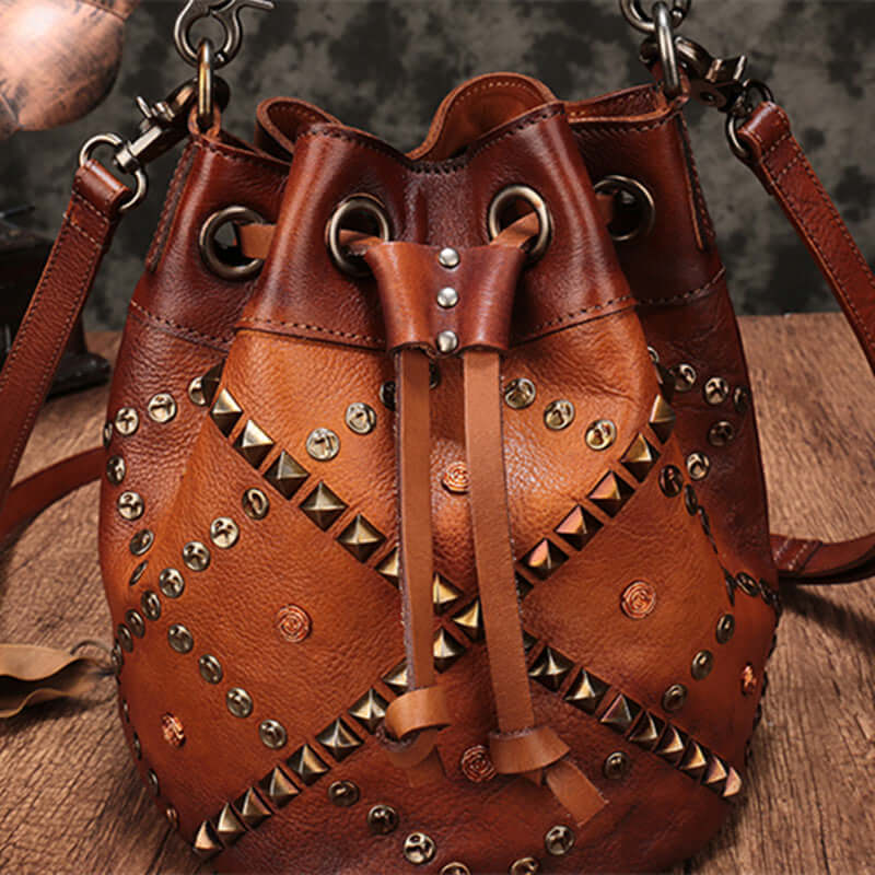 Cowhide Bucket Shoulder Bag With Rivet Detail featuring a stylish design and durable materials.